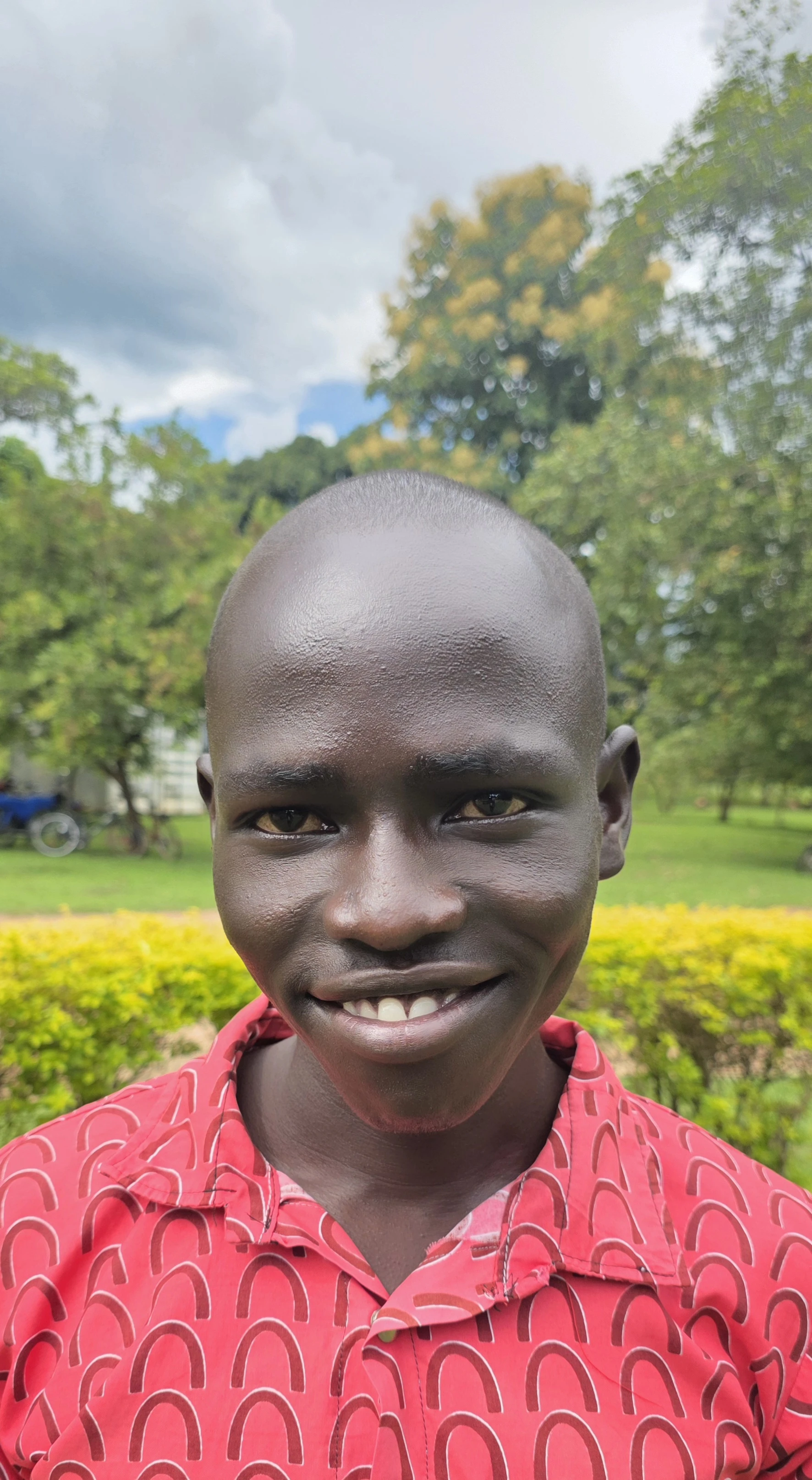 A student smiling after graduating from ECU